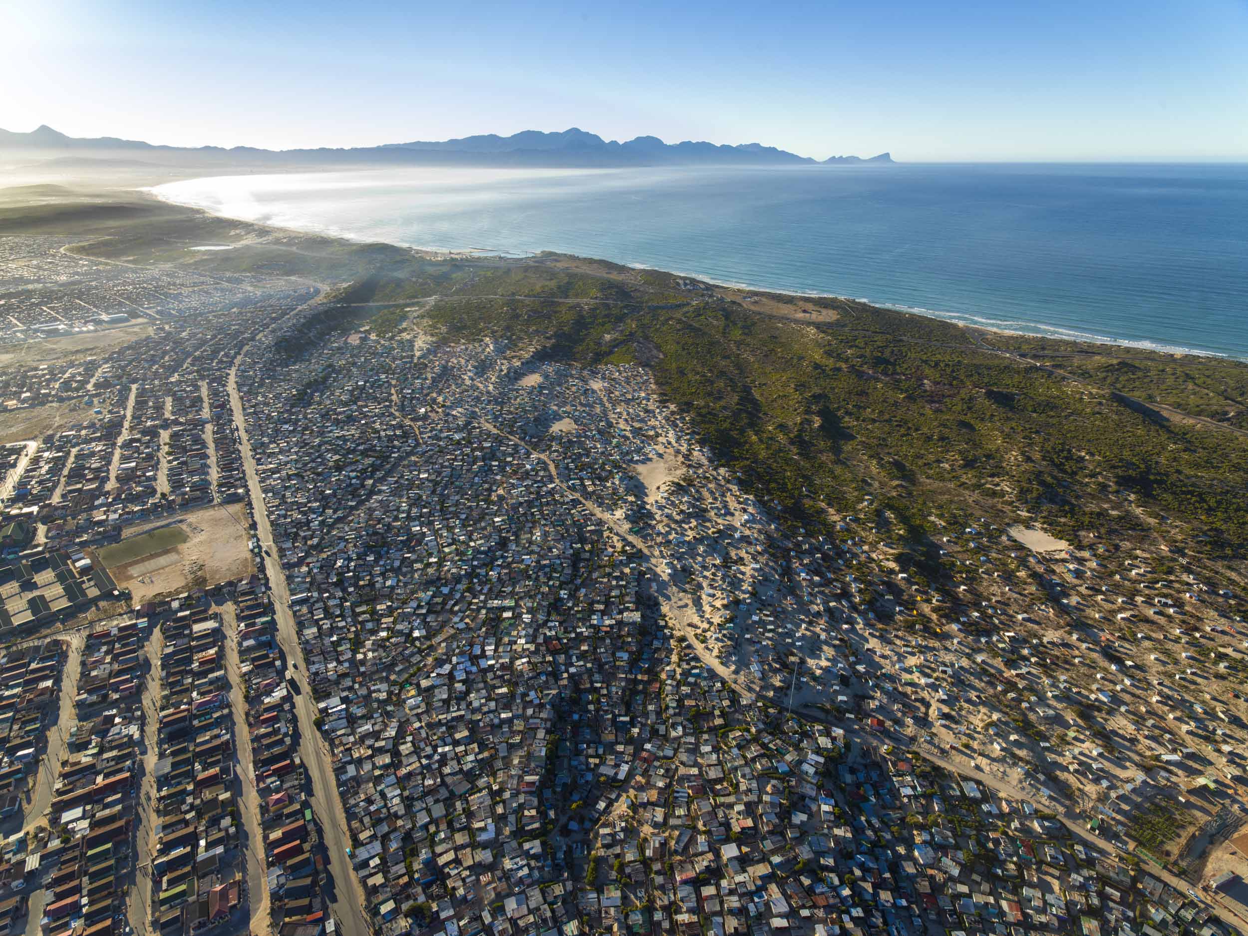 The Cape Flats townships meeting the sea, from the air