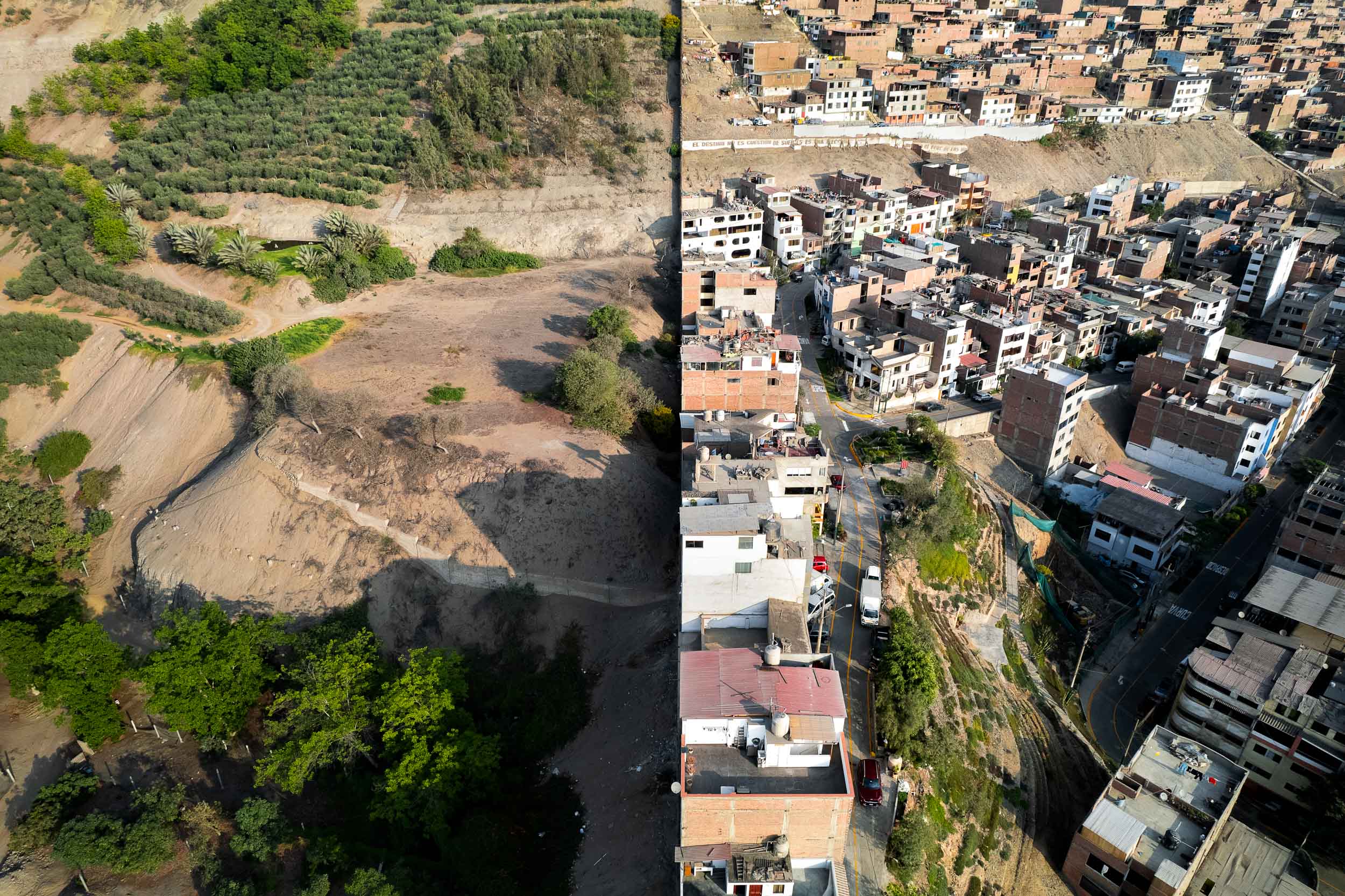 The Wall of Shame dividing Las Casuarinas from Pamplona Alta, from the air